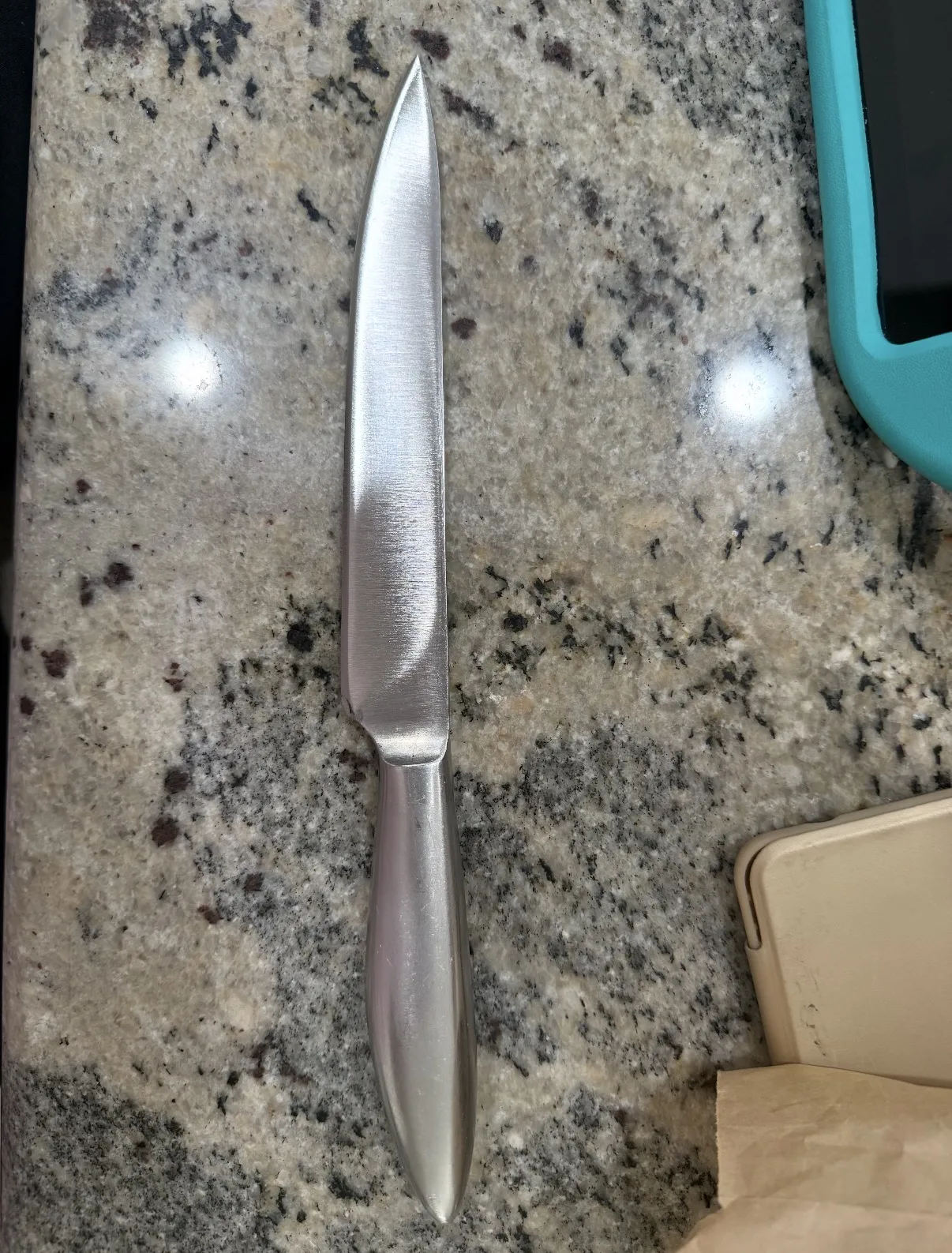 The same kitchen knife after its blade was restored and sharpened